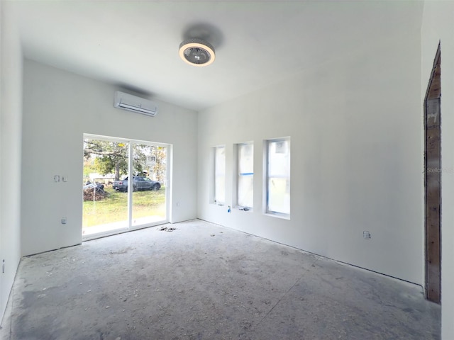 unfurnished room with a wall mounted air conditioner