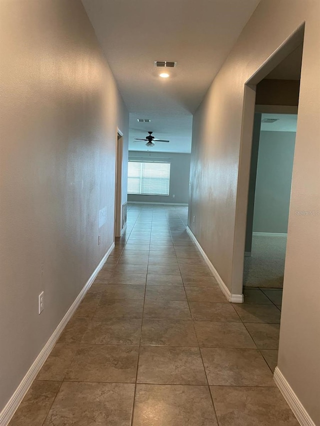 hall featuring tile patterned flooring