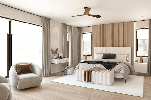 bedroom with light hardwood / wood-style floors and ceiling fan