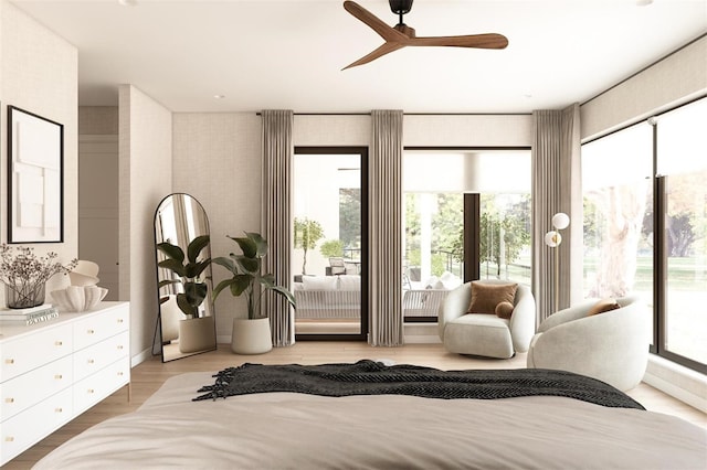 bedroom featuring hardwood / wood-style flooring, ceiling fan, access to exterior, and multiple windows