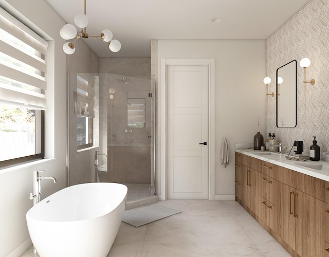 7176 S Shore Dr, South Pasadena, FL 33707 - bathroom with marble look tiles, a shower stall, vanity, a freestanding tub, and a chandelier