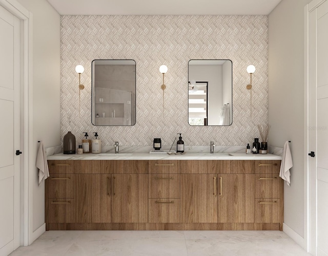 7176 S Shore Dr, South Pasadena, FL 33707 - full bath with double vanity, marble finish flooring, baseboards, and an accent wall