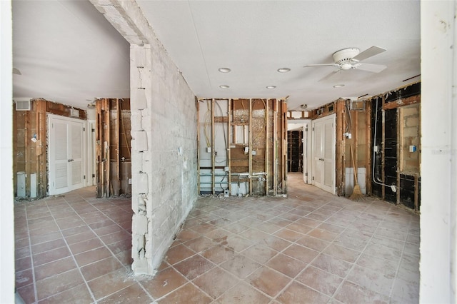 interior space with ceiling fan