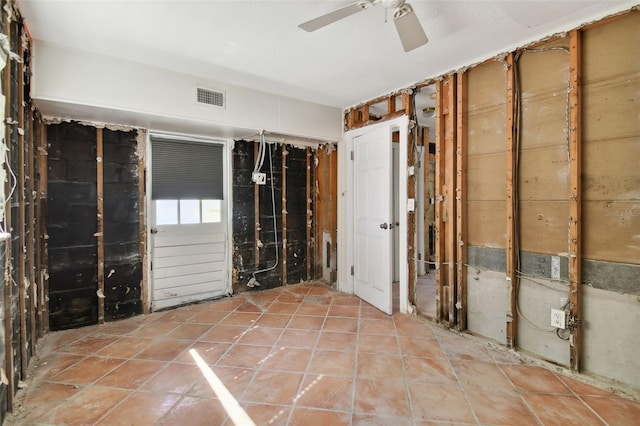 interior space featuring ceiling fan