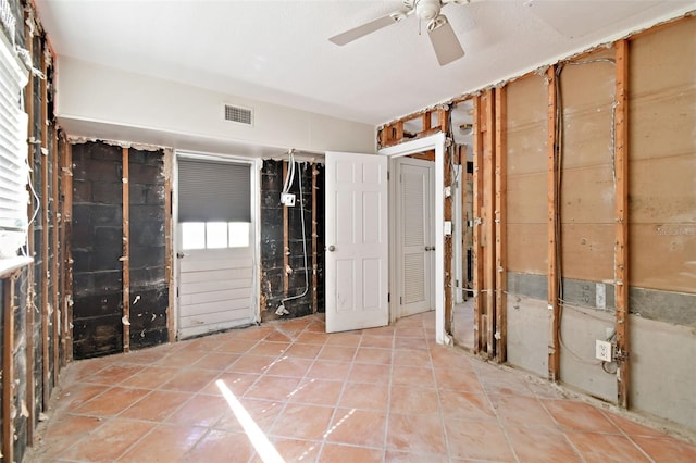 interior space featuring ceiling fan