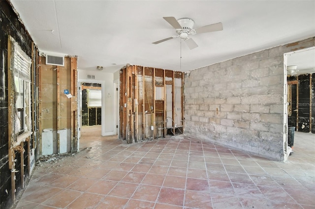 spare room with ceiling fan