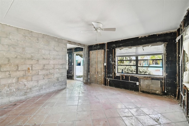 unfurnished room with ceiling fan