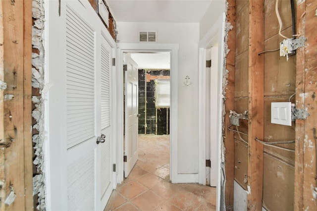 hallway with light tile patterned floors