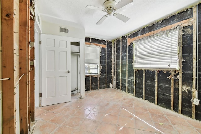 interior space with plenty of natural light and ceiling fan