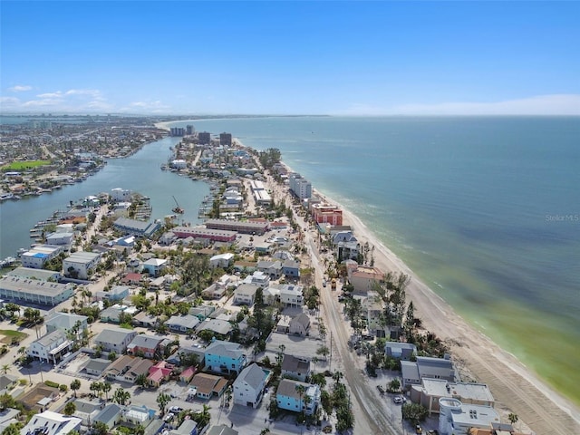 birds eye view of property with a view of the beach and a water view