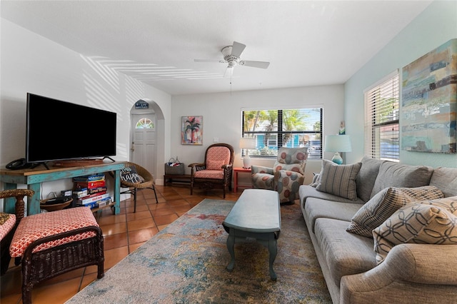 tiled living room featuring ceiling fan