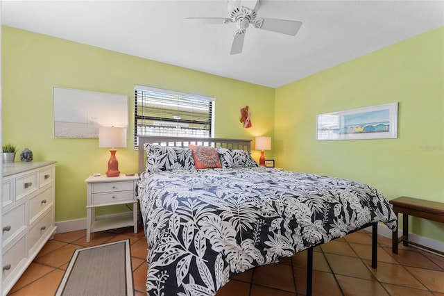 tiled bedroom featuring ceiling fan