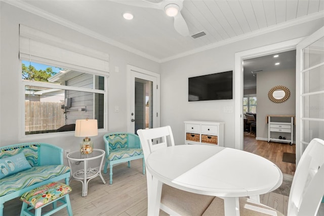 dining space featuring ornamental molding, hardwood / wood-style floors, and ceiling fan