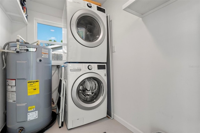 laundry room with stacked washing maching and dryer and water heater