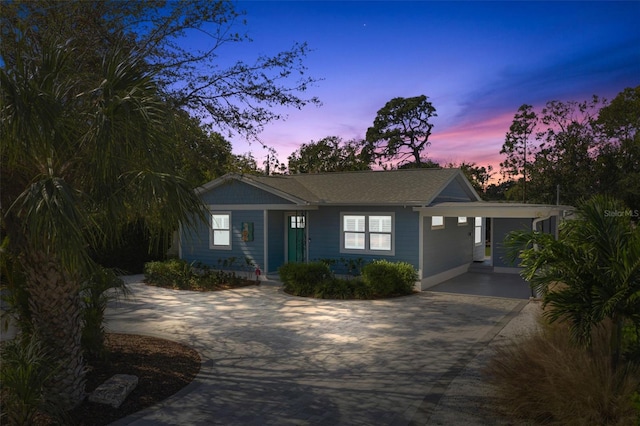 single story home featuring a carport