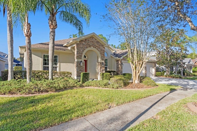 view of front of house with a front lawn and a garage