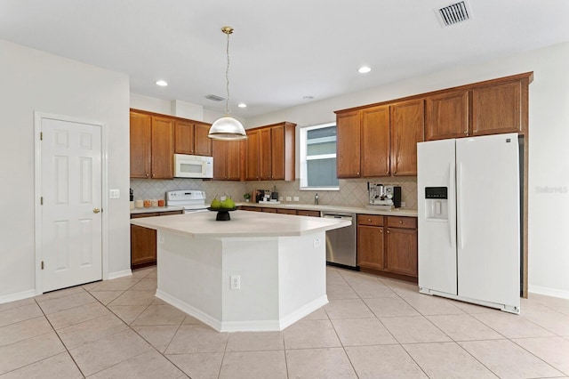 kitchen featuring a kitchen island, backsplash, decorative light fixtures, white appliances, and light tile patterned floors