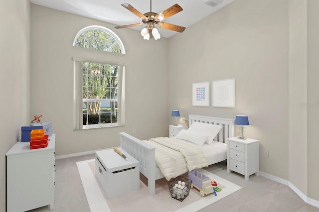 carpeted bedroom featuring ceiling fan