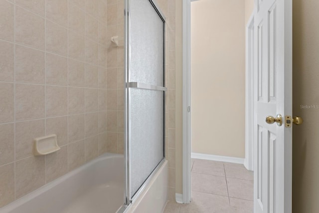 bathroom with tile patterned flooring and enclosed tub / shower combo