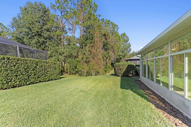 view of yard featuring a lanai