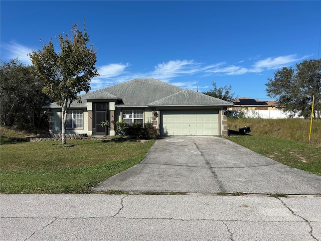 view of front of house with a front lawn and a garage