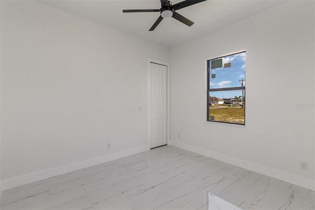 spare room with ceiling fan