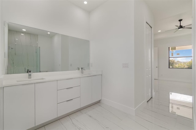 bathroom with an enclosed shower, vanity, and ceiling fan