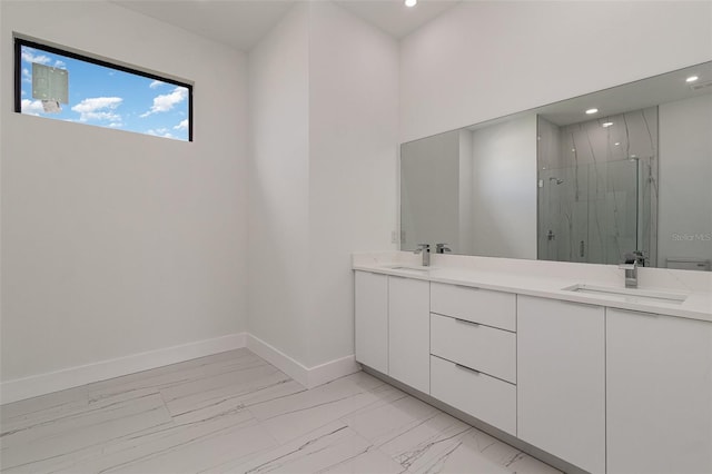 bathroom with vanity and a shower with shower door