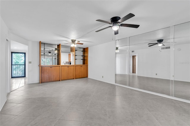 empty room with light tile patterned floors