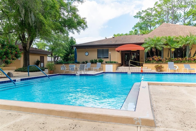 view of pool featuring a patio area