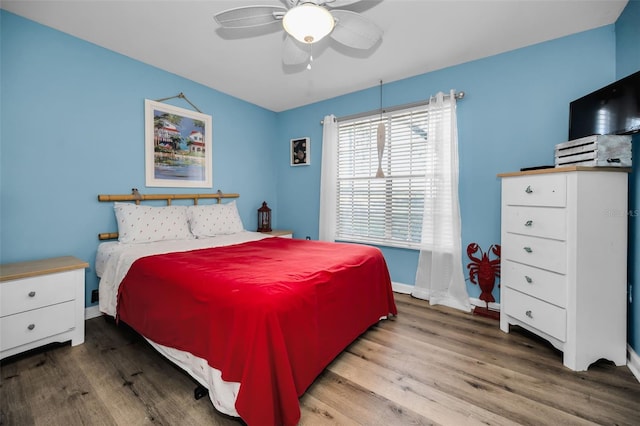 bedroom featuring hardwood / wood-style floors and ceiling fan