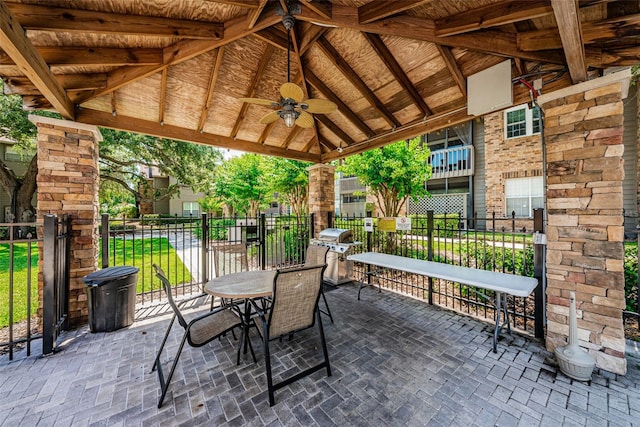 view of patio featuring a gazebo, ceiling fan, and grilling area