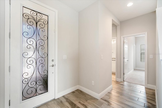 entryway with hardwood / wood-style flooring