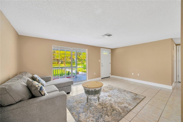 tiled living room with a textured ceiling