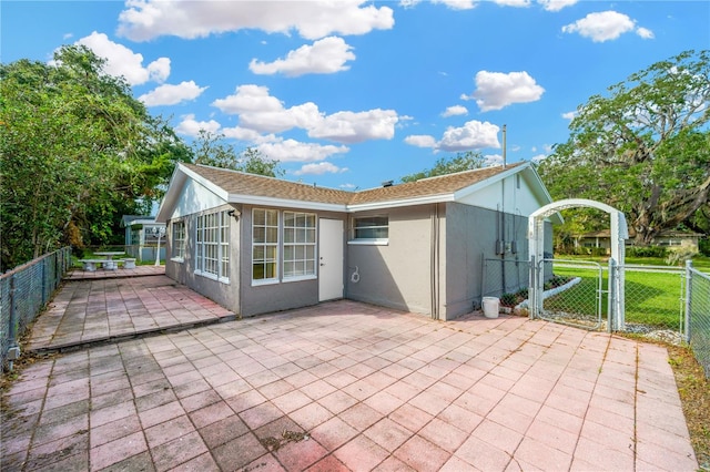 back of property with a patio area