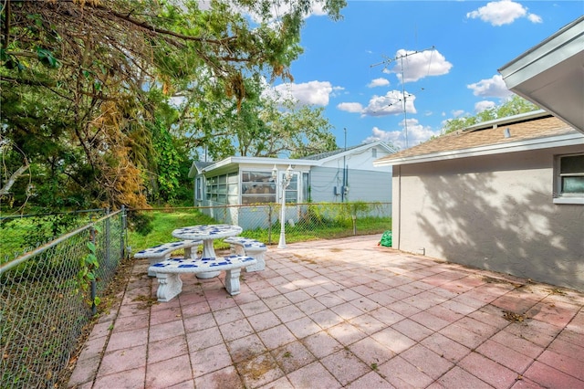 view of patio / terrace with a sunroom