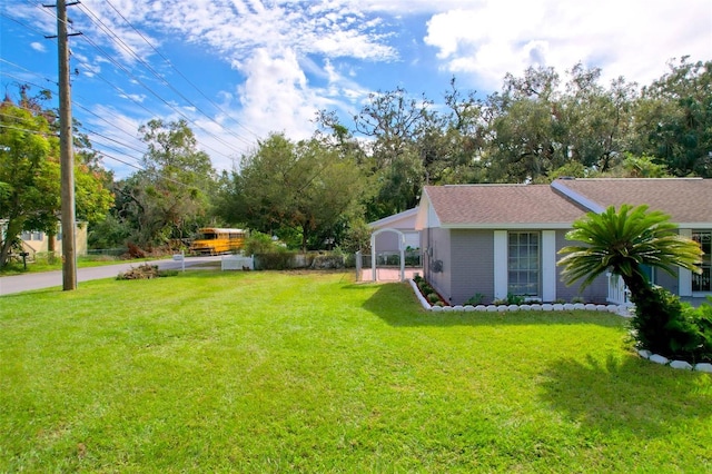 view of yard featuring a carport