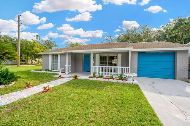 ranch-style home with a garage, a front lawn, and a porch