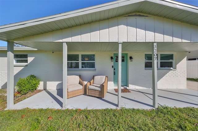 3207 Acacia St, Lutz, FL 33558 - doorway to property with brick siding and covered porch