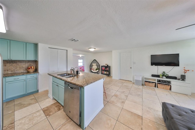 3207 Acacia St, Lutz, FL 33558 - kitchen with open floor plan, a sink, dishwasher, tasteful backsplash, and a kitchen island with sink