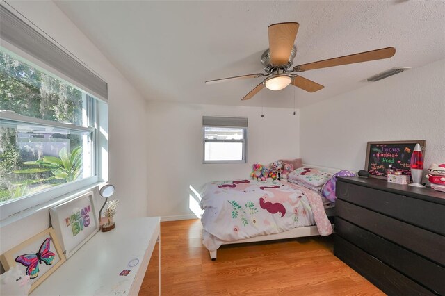 3207 Acacia St, Lutz, FL 33558 - bedroom with light wood finished floors and a ceiling fan