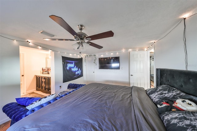 3207 Acacia St, Lutz, FL 33558 - bedroom featuring baseboards, rail lighting, and a ceiling fan