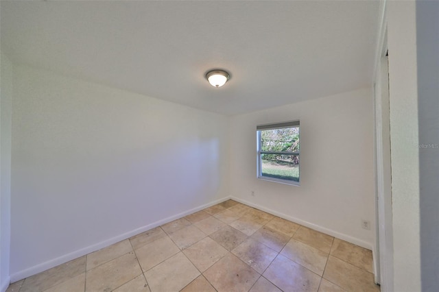 3207 Acacia St, Lutz, FL 33558 - unfurnished room featuring baseboards and light tile patterned floors