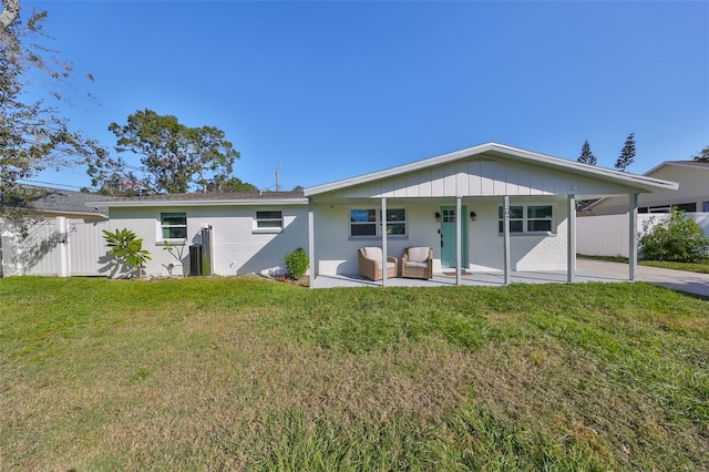 3207 Acacia St, Lutz, FL 33558 - back of property with a patio area and an outdoor hangout area