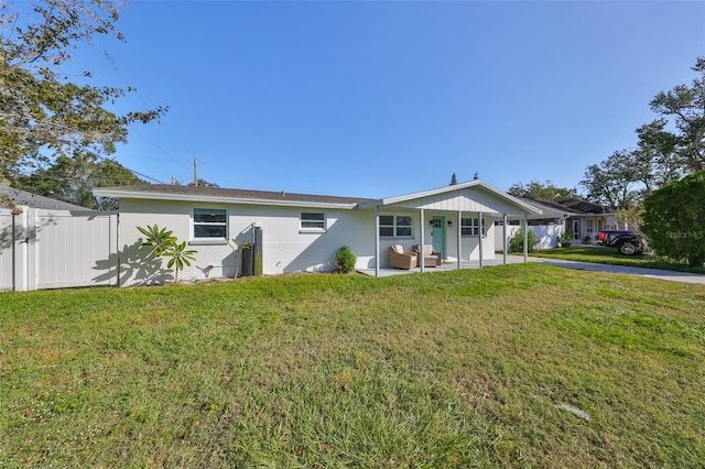 3207 Acacia St, Lutz, FL 33558 - view of front of property with an outdoor living space, a carport, and a patio area