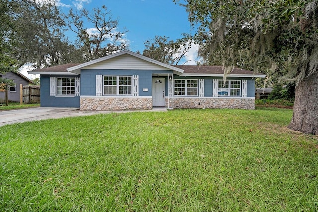 ranch-style house with a front lawn