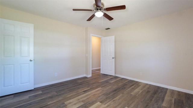 unfurnished room featuring ceiling fan and dark hardwood / wood-style floors