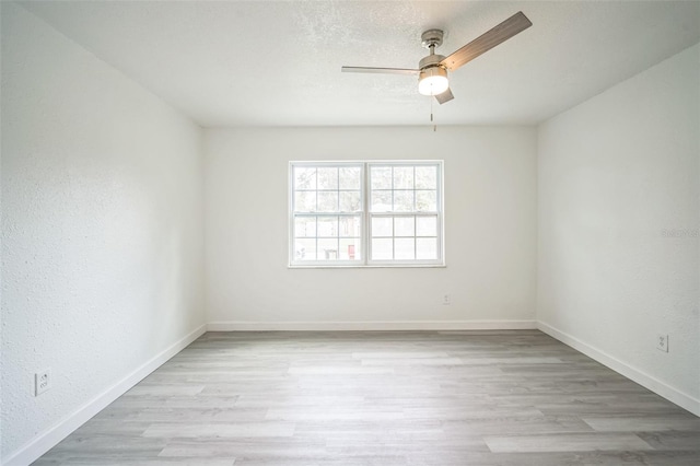 unfurnished room featuring light wood-type flooring and ceiling fan