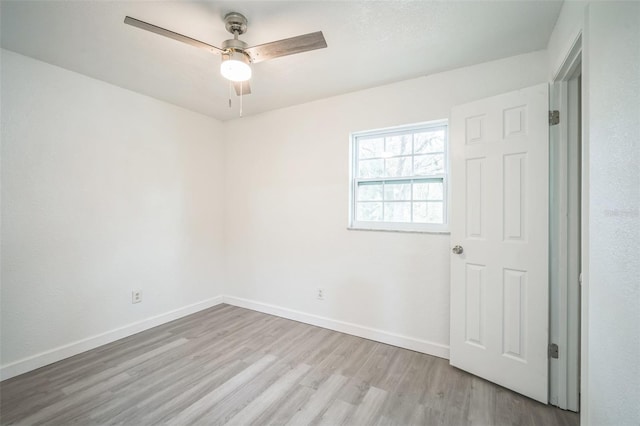 empty room featuring light hardwood / wood-style floors and ceiling fan