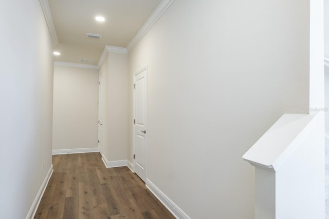 hallway featuring crown molding and dark hardwood / wood-style floors